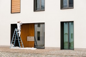 painting-maintenance-person-painting-white-building
